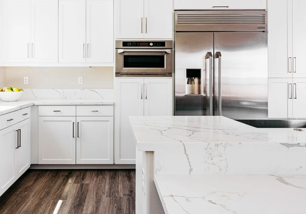 White Kitchen with Marble Countertops for a Premium Feel