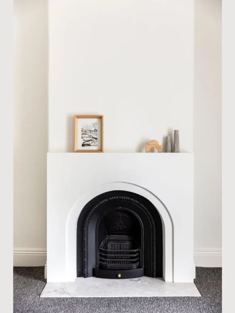 Arched Plaster Surrounds with Floating Oak Ledge Mantels