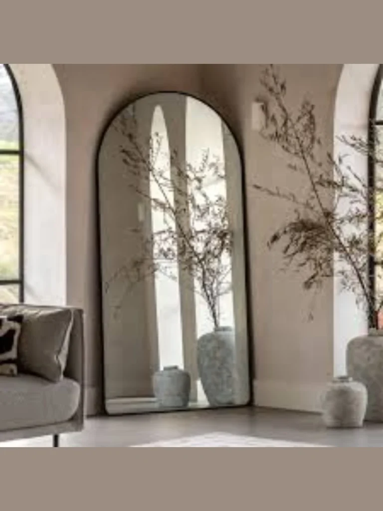 Tall Arched Mirrors Behind an Armchair