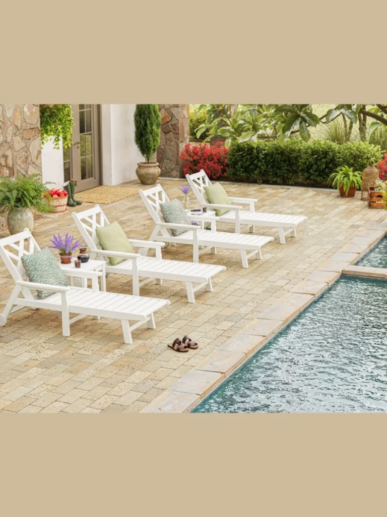 Arrange Matching Teak Chaise Lounges with Crisp White Cushions
