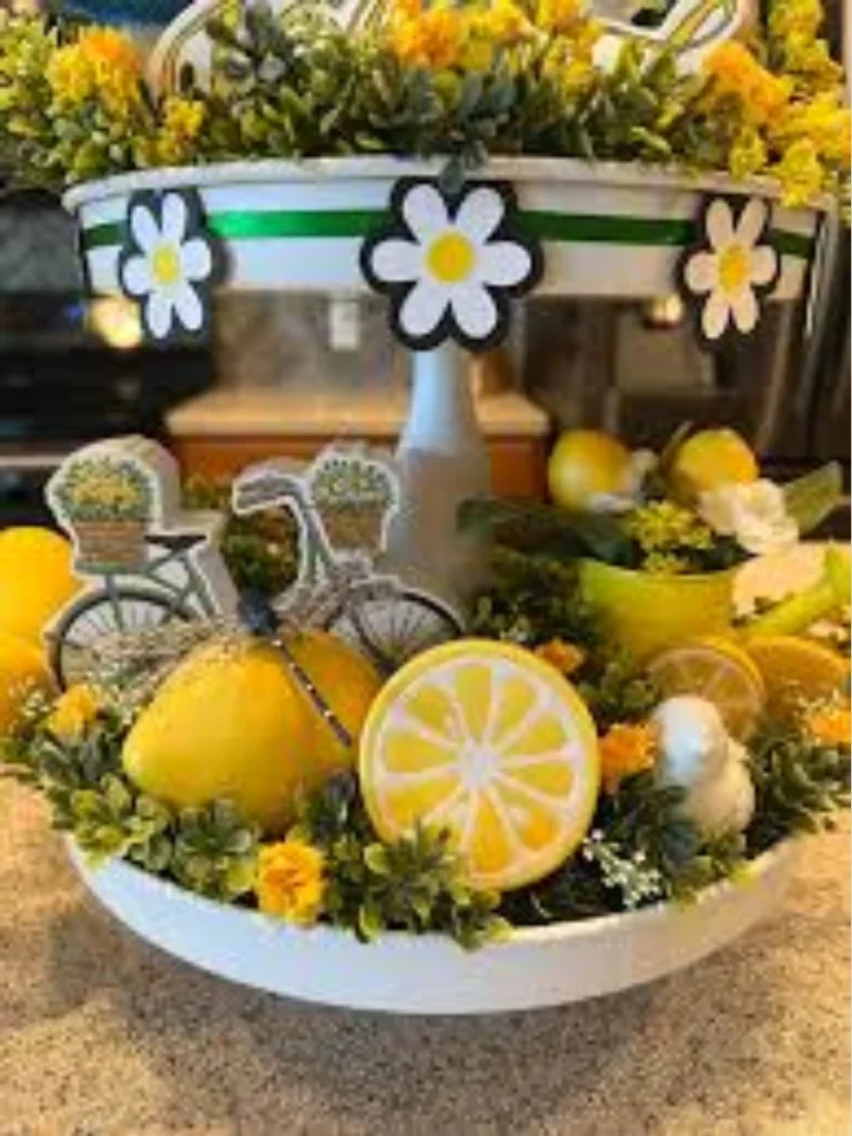 Arrange Mini Faux Lemon Slices and a Tiny Yellow Pitcher on the Bottom Base