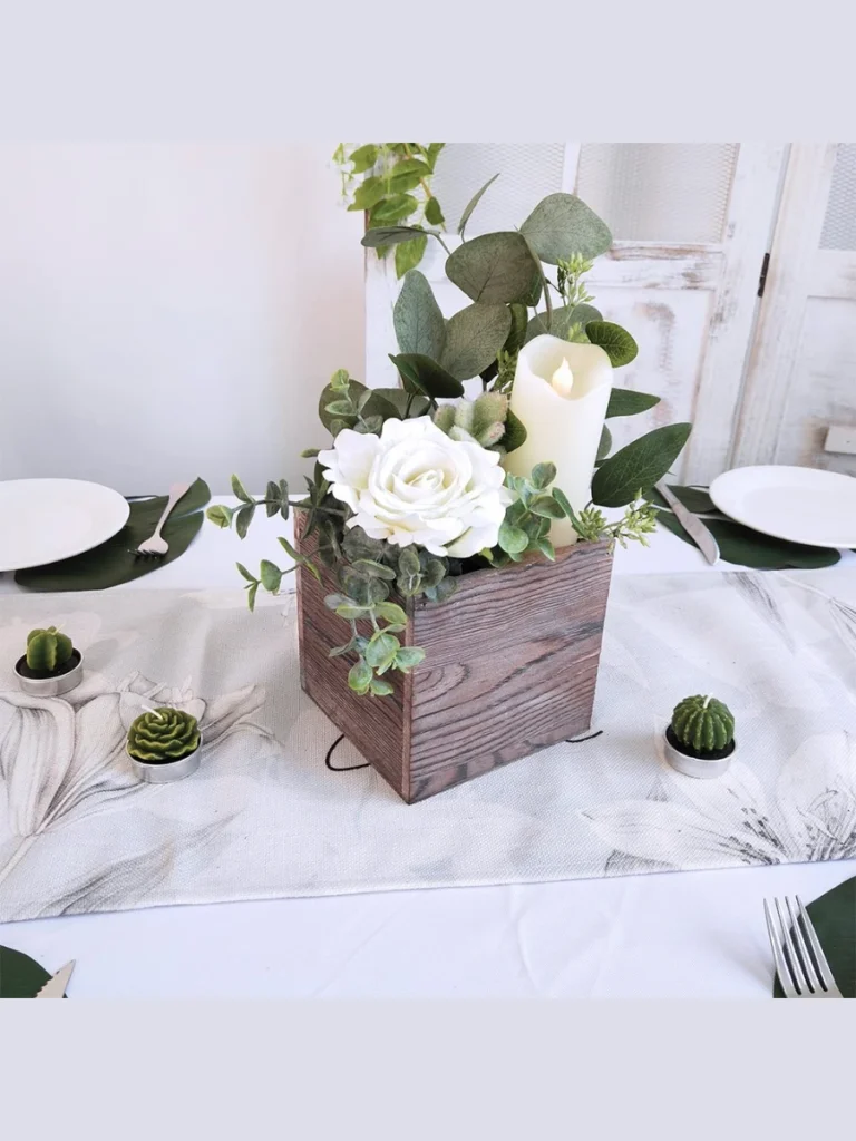 Center a Low Profile Distressed White Wooden Planter Box Filled with Faux Plastic Succulents