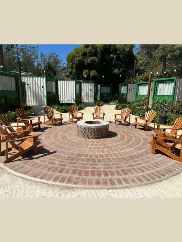 Circle Slatted Cedar Adirondack Chairs Around a Natural Stone Hearth