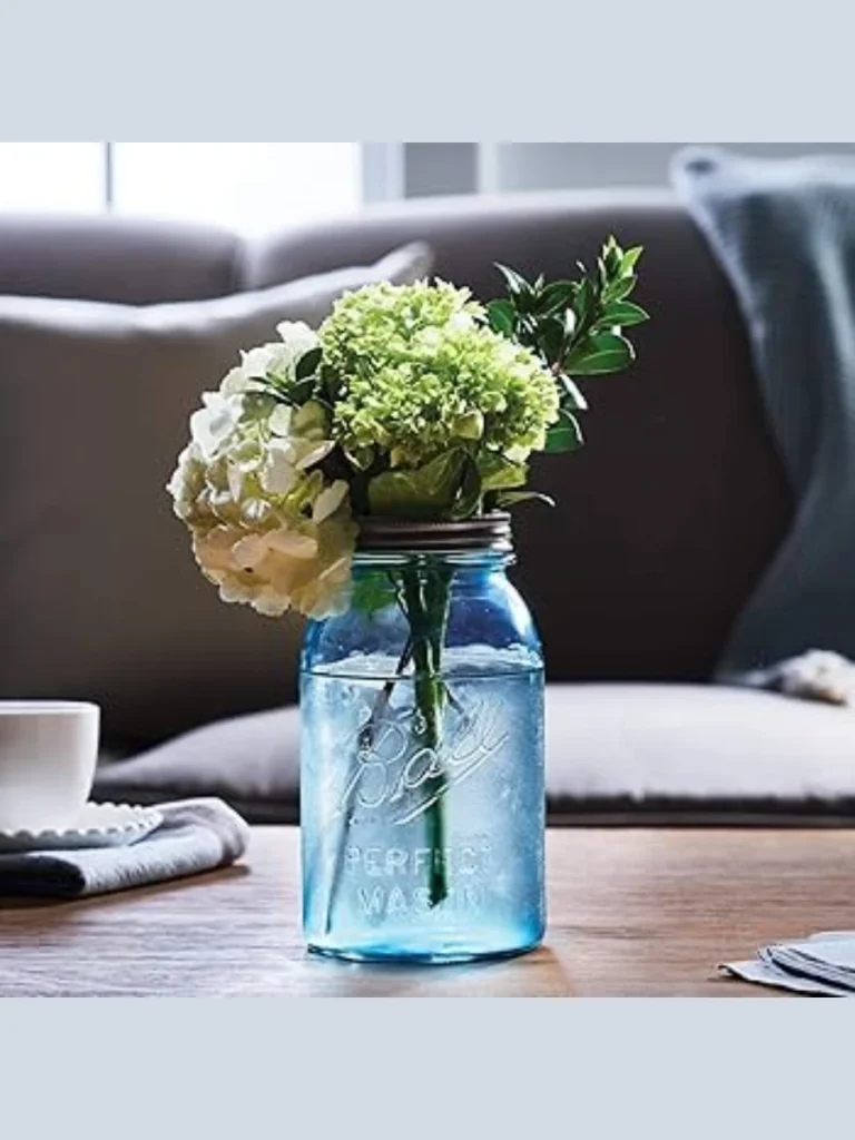 Cluster Delicate White Cosmos Inside an Old Vintage Blue Ball Canning Jar