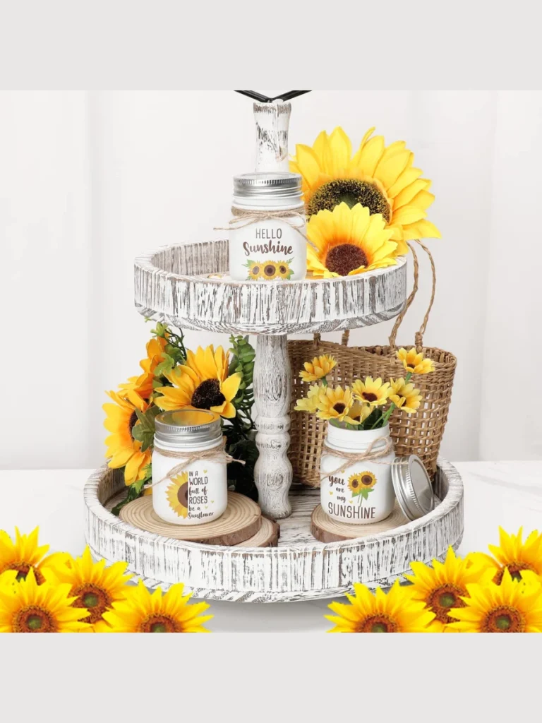Drop Individual Faux Sunflower Heads Inside a Row of Three Clear Glass Salt Shakers