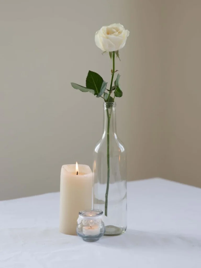 Drop Individual White Rose Heads Inside a Row of Three Vintage Glass Salt Shakers