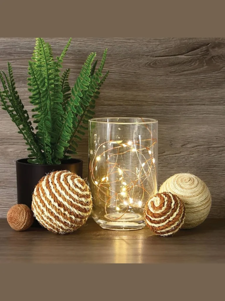 Drop a Long String of Warm White Copper Wire Fairy Lights Inside an Amber Glass Jug