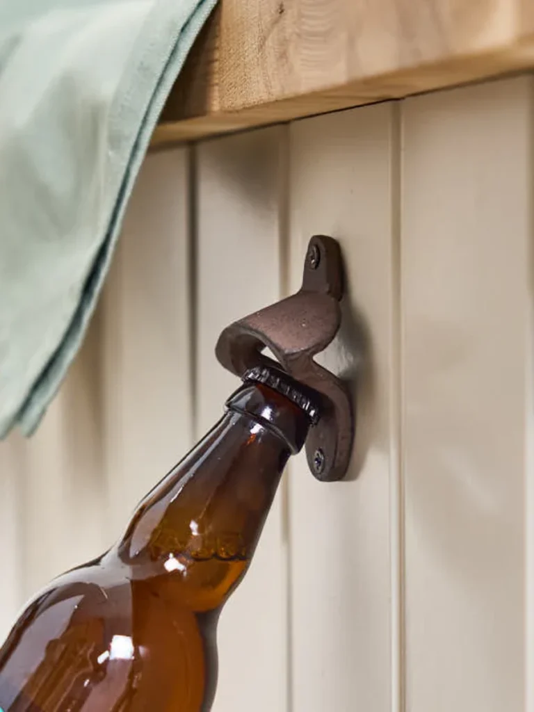 Embed a Heavy Cast Iron Bottle Opener Onto the Table Framework