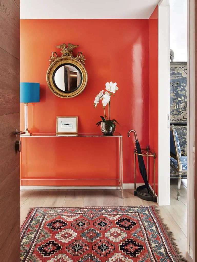 Hang a Bright Orange Circular Mirror in the Dark Hallway