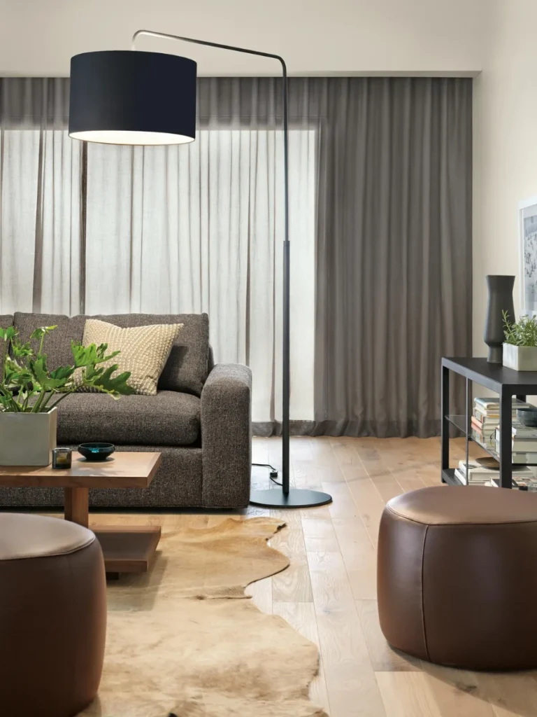 Heavy Counterweight Floor Lamps Arching Over Table Centers