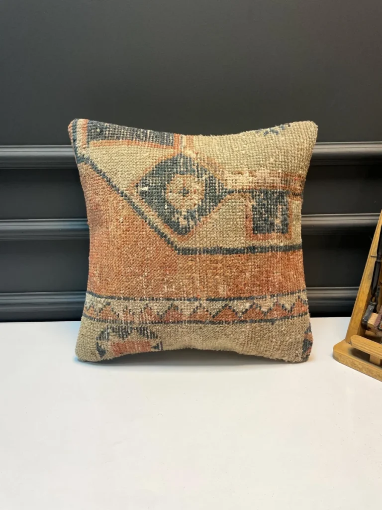 Mix Soft Clay Terracotta Squares with Dusty Sage Boxwood Weaves and Cream Tassel Accents