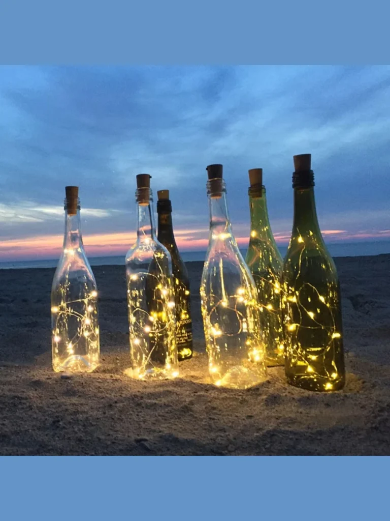 Slide a Long String of Battery Powered Copper Wire LED Lights Inside an Old Wine Bottle