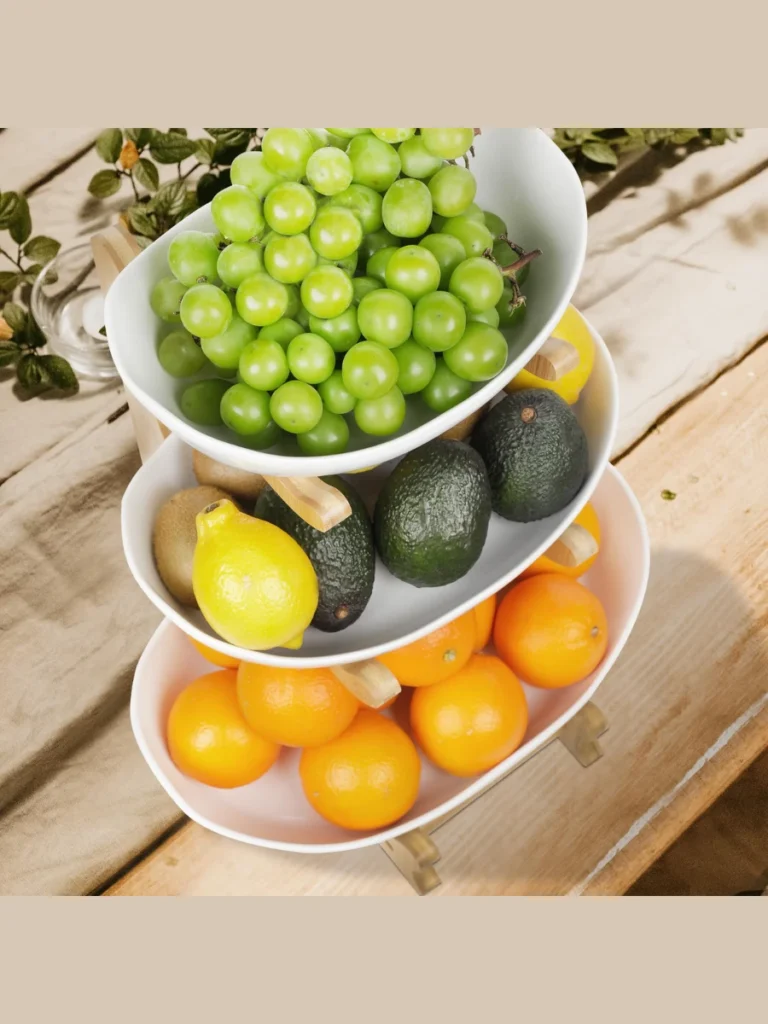 Stack Three White Ceramic Bowls Filled with Fresh Green Limes as a Central Fruit Tower