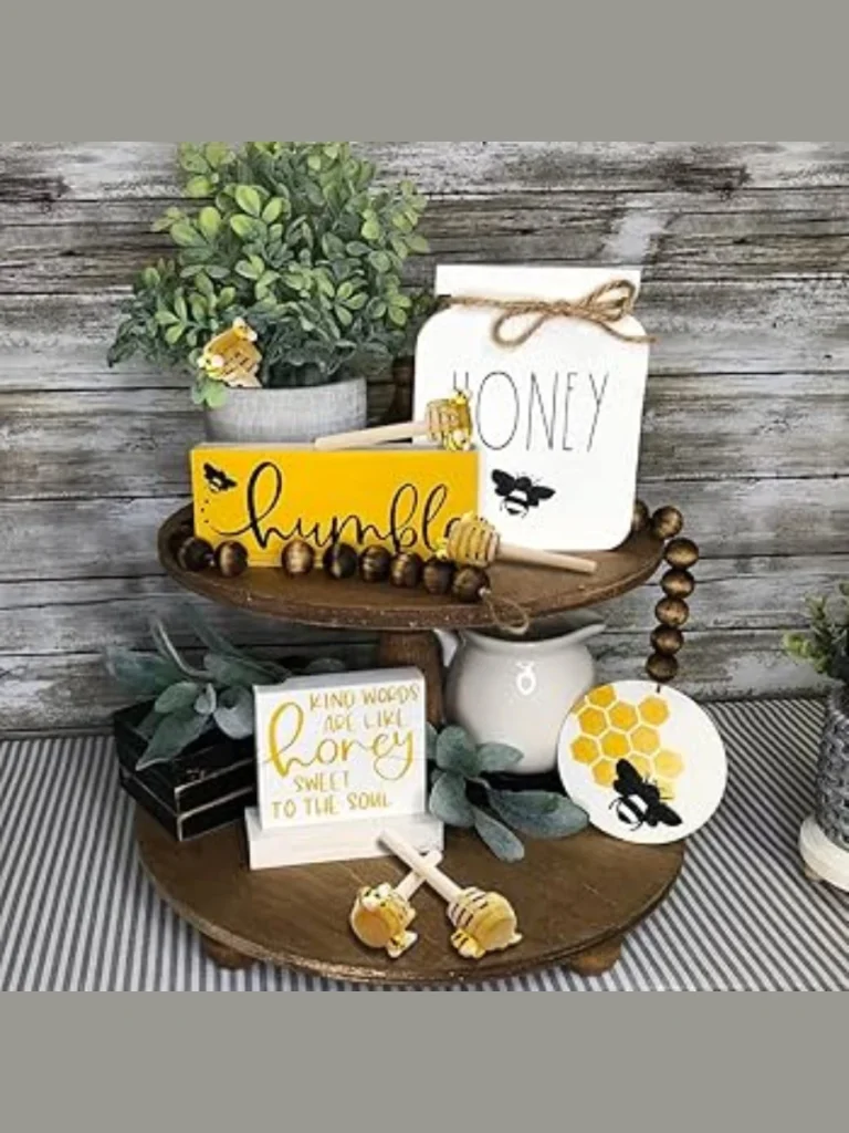 Strip a Miniature Fabric Beehive and Small Wooden Honey Dippers Around the Tops