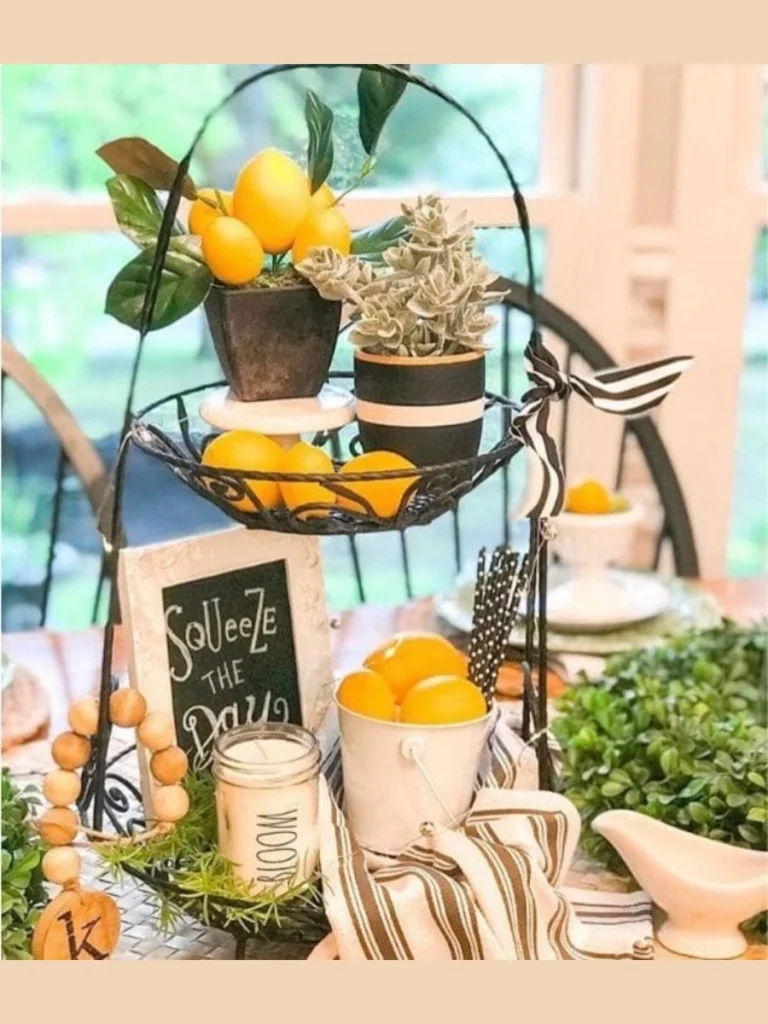 Twist a Long Strand of Faux Lemon Leaf Garland Across the Main Tier Rod