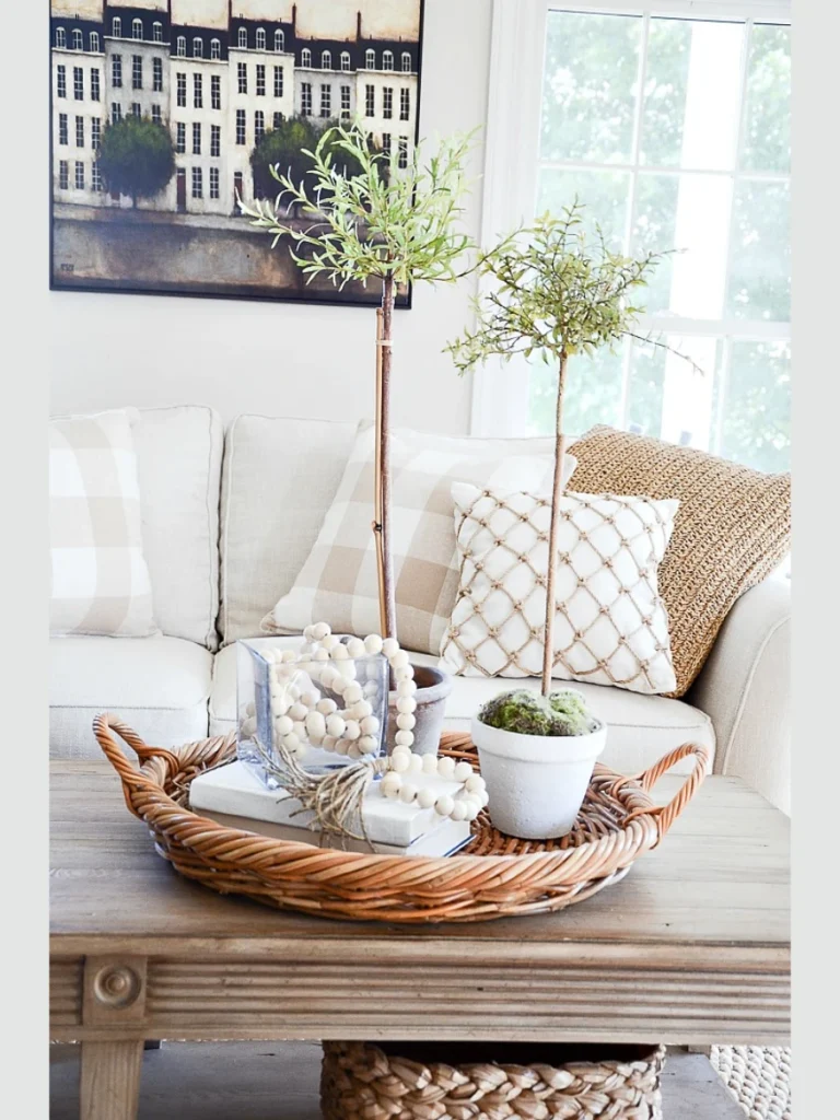 Weave a Full Strand of Faux Lemon Leaf Garland Across a White Wooden Bead Strand Jug